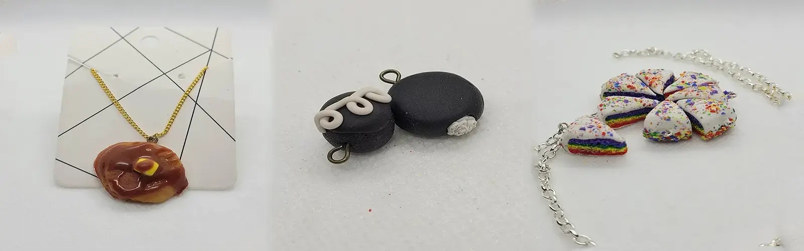 a pancake necklace, Hostess cupcake charms, and pride cake slice necklace