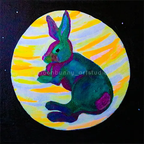 A purple and green bunny laying down on a colorful planet.